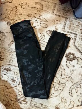 Spanx Faux Leather Camo Leggings in the Matte Black Camo colorway.